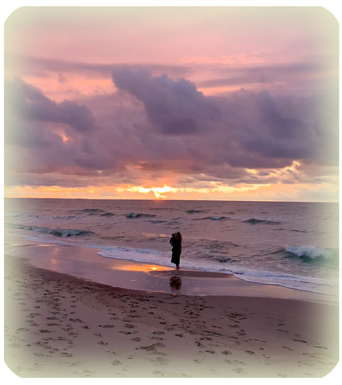 person at beach at sunset